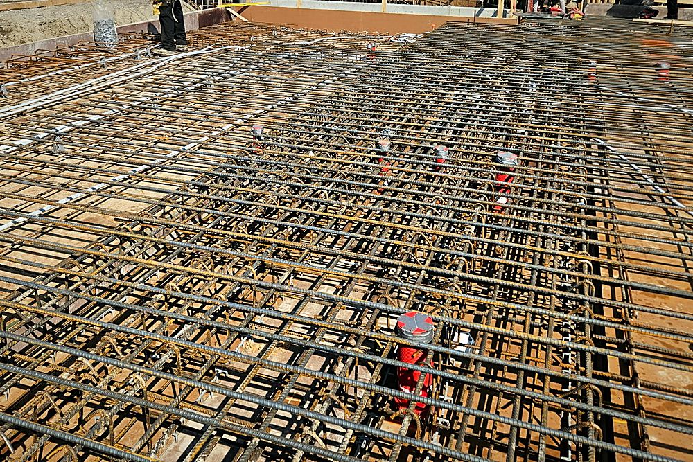 A slab mat tied out with bar chairs and conduit set through it