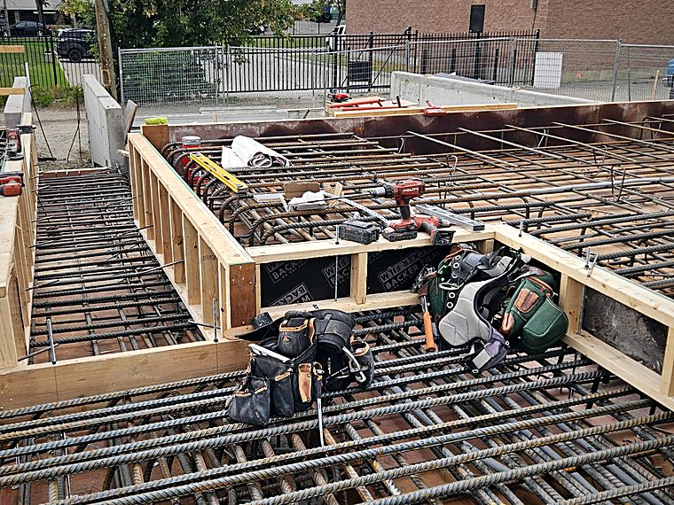 A deck mat tied around a blockout, formwork boxed and braced before the pour